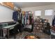 Walk-in closet including hanging racks, shelves, and a Fender rug at 7670 W Sands Dr, Peoria, AZ 85383