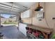 Garage converted to workshop featuring a workbench, storage, and pegboard with natural light at 7670 W Sands Dr, Peoria, AZ 85383