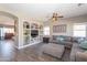Cozy living room featuring a built-in media center and a comfortable sectional sofa at 7670 W Sands Dr, Peoria, AZ 85383