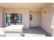 Cozy front porch featuring a seating area, window, a secure screen door, and classic desert style color palette at 7670 W Sands Dr, Peoria, AZ 85383