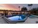 Luxury backyard boasts an inviting pool, spa, fire pit, and outdoor kitchen, perfect for upscale outdoor living at 8031 N 12Th Ave, Phoenix, AZ 85021