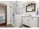 Bathroom showcasing glass-enclosed shower with subway tile and wood-look floors at 8031 N 12Th Ave, Phoenix, AZ 85021