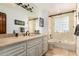Well-maintained bathroom showcasing double sinks and a shower-tub combination at 8031 N 12Th Ave, Phoenix, AZ 85021