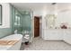 Bright bathroom featuring a soaking tub, walk-in shower, and patterned tile floors at 8031 N 12Th Ave, Phoenix, AZ 85021