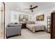 Bright bedroom with a comfortable couch, ceiling fan, and natural light from the window at 8031 N 12Th Ave, Phoenix, AZ 85021