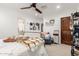 Cozy bedroom featuring a ceiling fan, comfortable bed, and stylish decor at 8031 N 12Th Ave, Phoenix, AZ 85021
