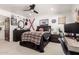 Inviting bedroom with unique decorations, ceiling fan, and workspace at 8031 N 12Th Ave, Phoenix, AZ 85021