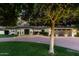Elegant single-story home illuminated at dusk, featuring a lovely water fountain at 8031 N 12Th Ave, Phoenix, AZ 85021