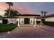 Attractive front entrance illuminated at twilight, complemented by palm trees at 8031 N 12Th Ave, Phoenix, AZ 85021