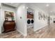 Hallway view with a laundry room and decoratively furnished walls at 8031 N 12Th Ave, Phoenix, AZ 85021