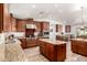 Modern kitchen features stainless steel appliances, wood cabinets, and an island at 8031 N 12Th Ave, Phoenix, AZ 85021