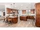 Open kitchen with wooden cabinets, granite countertops, stainless steel appliances, and two islands at 8031 N 12Th Ave, Phoenix, AZ 85021