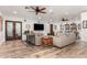 Spacious living room with comfortable sofas, a TV and built-in bookshelves at 8031 N 12Th Ave, Phoenix, AZ 85021