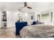 Comfortable main bedroom with ceiling fan, large windows, and ample closet space at 8031 N 12Th Ave, Phoenix, AZ 85021