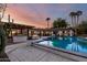 Backyard pool and spa area featuring a built-in barbecue and comfortable seating illuminated at twilight at 8031 N 12Th Ave, Phoenix, AZ 85021