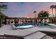 Stunning backyard pool and patio area at twilight, perfect for entertaining at 8031 N 12Th Ave, Phoenix, AZ 85021