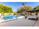 Inviting backyard featuring a pool, spa, and outdoor kitchen with built-in barbecue at 8031 N 12Th Ave, Phoenix, AZ 85021