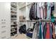 Organized walk-in closet with shelves, drawers, and hanging rods for clothes and shoe storage at 8031 N 12Th Ave, Phoenix, AZ 85021
