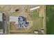 Bird's-eye view of the property showcasing the home, solar panels, fencing, and surrounding landscape at 8429 S 229Th Ln, Buckeye, AZ 85326