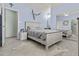 Bedroom with a light blue color scheme, stylish decor, and tile flooring with area rug at 8429 S 229Th Ln, Buckeye, AZ 85326
