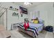 Charming bedroom with a comfortable bed, playful decor, and a window with bright, natural light at 8429 S 229Th Ln, Buckeye, AZ 85326