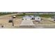 Beautiful ranch-style home boasts a pristine, light-colored exterior, solar panels and three-car garage at 8429 S 229Th Ln, Buckeye, AZ 85326