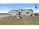 Eye-catching single-story house featuring a bright exterior, solar panels and large driveway and landscaped grounds at 8429 S 229Th Ln, Buckeye, AZ 85326
