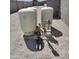 Exterior view of water storage tanks and plumbing in a fenced in yard at 8429 S 229Th Ln, Buckeye, AZ 85326