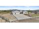 A beautiful home with a three-car garage, solar panels, and white perimeter fence on acreage at 8429 S 229Th Ln, Buckeye, AZ 85326
