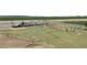 A fenced horse corral, with equipment and shelter, providing a safe and functional space at 8429 S 229Th Ln, Buckeye, AZ 85326