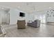 Inviting living room with tile floors, comfortable seating, and plenty of natural light at 8429 S 229Th Ln, Buckeye, AZ 85326