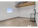 Bright living room featuring a window and wood laminate flooring at 8429 S 229Th Ln, Buckeye, AZ 85326