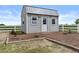 A well-maintained shed surrounded by gravel and a tidy border is set against a blue sky at 8429 S 229Th Ln, Buckeye, AZ 85326