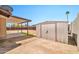 Large backyard featuring a storage shed and covered patio area at 9102 N 56Th Ln, Glendale, AZ 85302