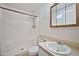 Functional bathroom featuring a shower, toilet, sink, and vanity with a medicine cabinet at 9102 N 56Th Ln, Glendale, AZ 85302