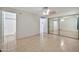 Bedroom with tile flooring and mirrored closet doors, providing ample storage at 9102 N 56Th Ln, Glendale, AZ 85302