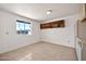 Bonus room showcasing ample natural light, tile flooring, and custom built-in shelves at 9102 N 56Th Ln, Glendale, AZ 85302
