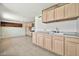 Spacious kitchen area with ample cabinets, sink and countertops at 9102 N 56Th Ln, Glendale, AZ 85302