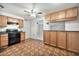 Spacious kitchen with wood cabinets and black appliances, offering ample counter space and storage at 9102 N 56Th Ln, Glendale, AZ 85302