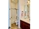 Well-lit bathroom features a shower-tub combination, toilet, and vanity with dark wood cabinets at 9249 E Desert Arroyos St, Scottsdale, AZ 85255
