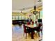 The formal dining area showcases an ornate chandelier and comfortably seats six, with many windows and natural light at 9249 E Desert Arroyos St, Scottsdale, AZ 85255