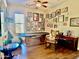 Large, themed game room featuring a pool table, various wall decorations, and lots of natural light from a window at 9249 E Desert Arroyos St, Scottsdale, AZ 85255