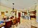 Open-concept kitchen with dark wood cabinets, stainless steel appliances, granite countertops, and a breakfast bar at 9249 E Desert Arroyos St, Scottsdale, AZ 85255
