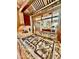 Gourmet stainless stovetop cooktop with custom hood and granite countertops at 9249 E Desert Arroyos St, Scottsdale, AZ 85255
