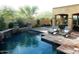 Inviting backyard pool area with patio, lounge chairs, and elegant landscaping at 9249 E Desert Arroyos St, Scottsdale, AZ 85255
