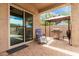Covered back patio with a grill and outdoor seating area at 9390 W Louise Dr, Peoria, AZ 85383