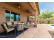 Covered patio with plenty of room for entertaining near the pool at 9390 W Louise Dr, Peoria, AZ 85383
