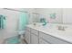 Bright bathroom with a double sink vanity and a shower-tub combination at 9390 W Louise Dr, Peoria, AZ 85383