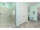 Bathroom featuring a glass-enclosed shower and tiled flooring, providing a modern and clean aesthetic at 9390 W Louise Dr, Peoria, AZ 85383