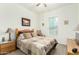 Well-lit bedroom with a cozy color scheme, a window, and standard closet at 9390 W Louise Dr, Peoria, AZ 85383